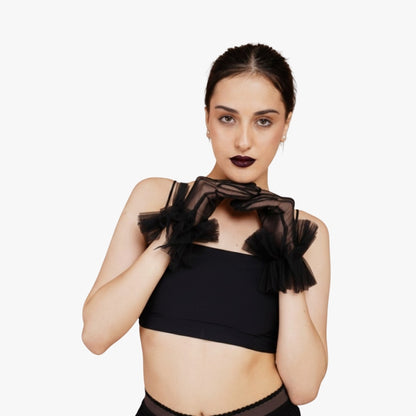  Model posing in Totka black transparent statement gloves for party wear.