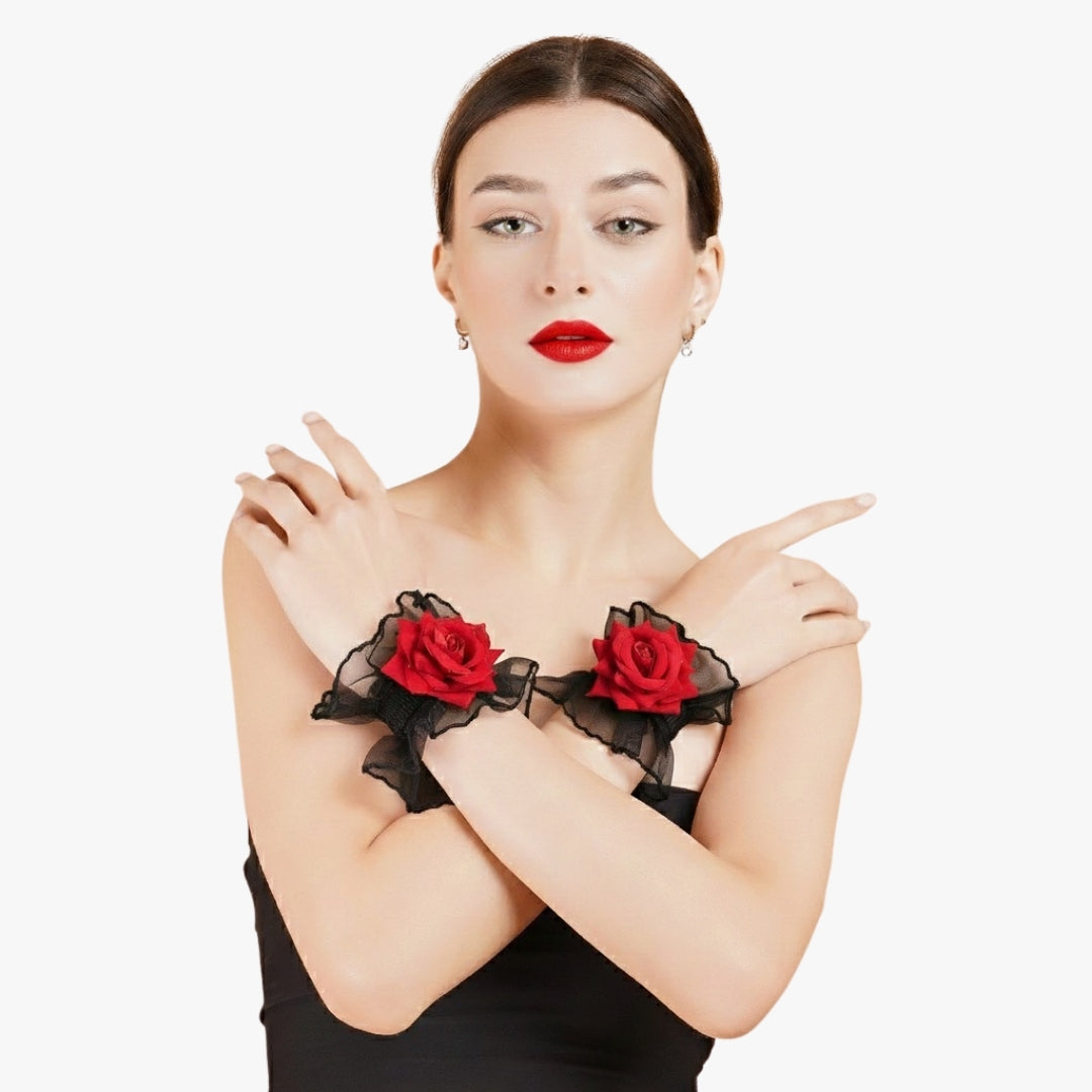 Front view of Totka red fabric rose wrist corsages on model's crossed arms; modern floral Haath Phool for Indian wedding guests.